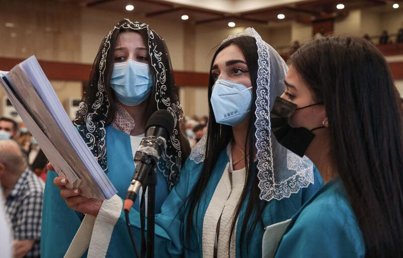 A choir sings during the church service in Erbil. AFP