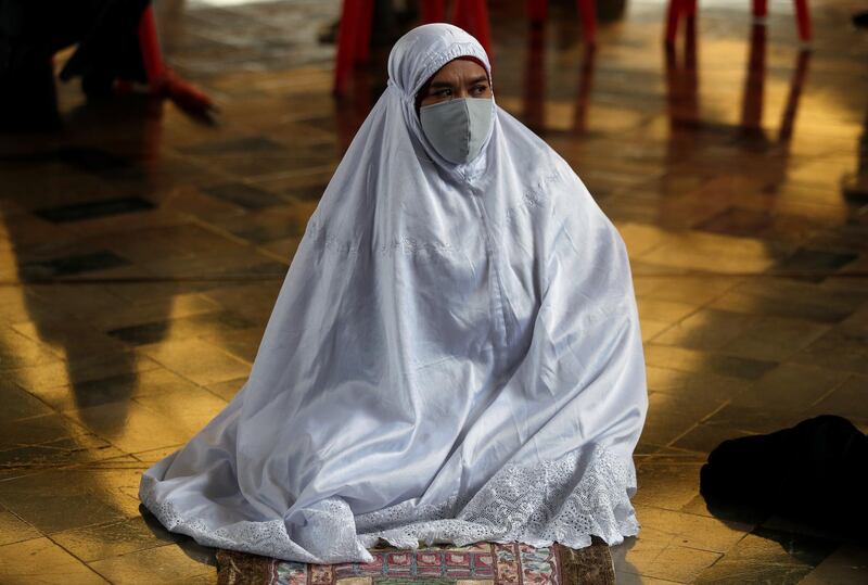 A woman at Ramadan prayers in Bangkok, Thailand.  Reuters