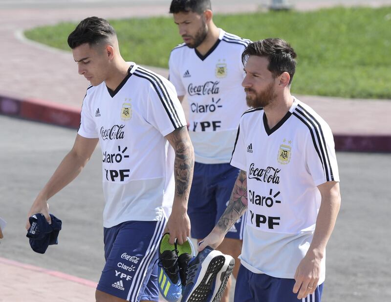 Lionel Messi (R) and midfielder Cristian Pavon (L) arrive at a training session at the team's base camp in Bronnitsy, on June 25. Juan Mabromata / AFP