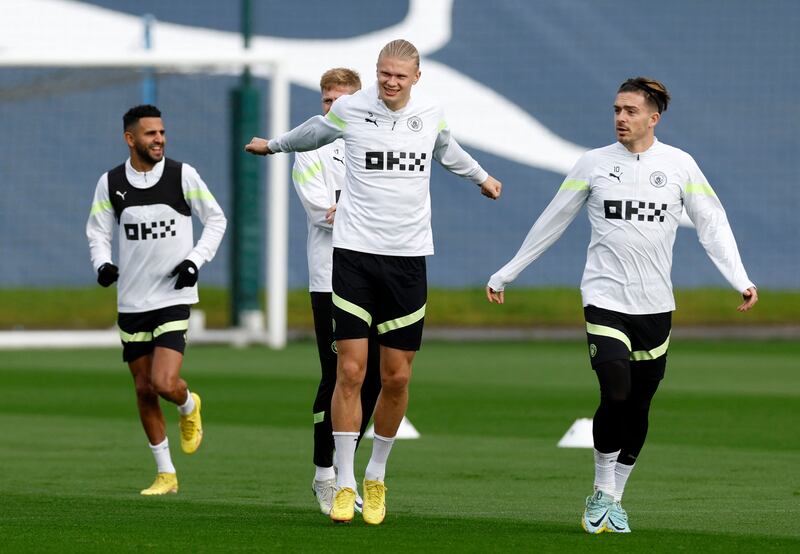 Manchester City players take part in a warm-up. Reuters