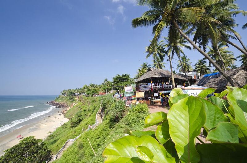 The cliff above Varkala Beach has multi-cuisine cafes and souvenir-stacked bazaars. Photo by Frank Bienewald / LightRocket via Getty Images