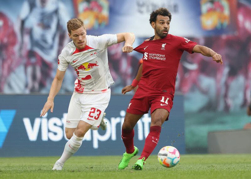 Marcel Halstenberg of RB Leipzig pulls the shirt of Liverpool attacker Mohamed Salah. Getty