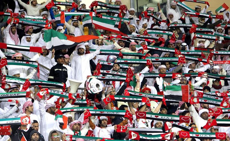 Emirati football fans cheer on their national team. Sales of Fifa World Cup 2014 tickets by nations other than those already listed amounts to 109,330, 7.3 per cent of the total. Ali Al-Saadi / AFP