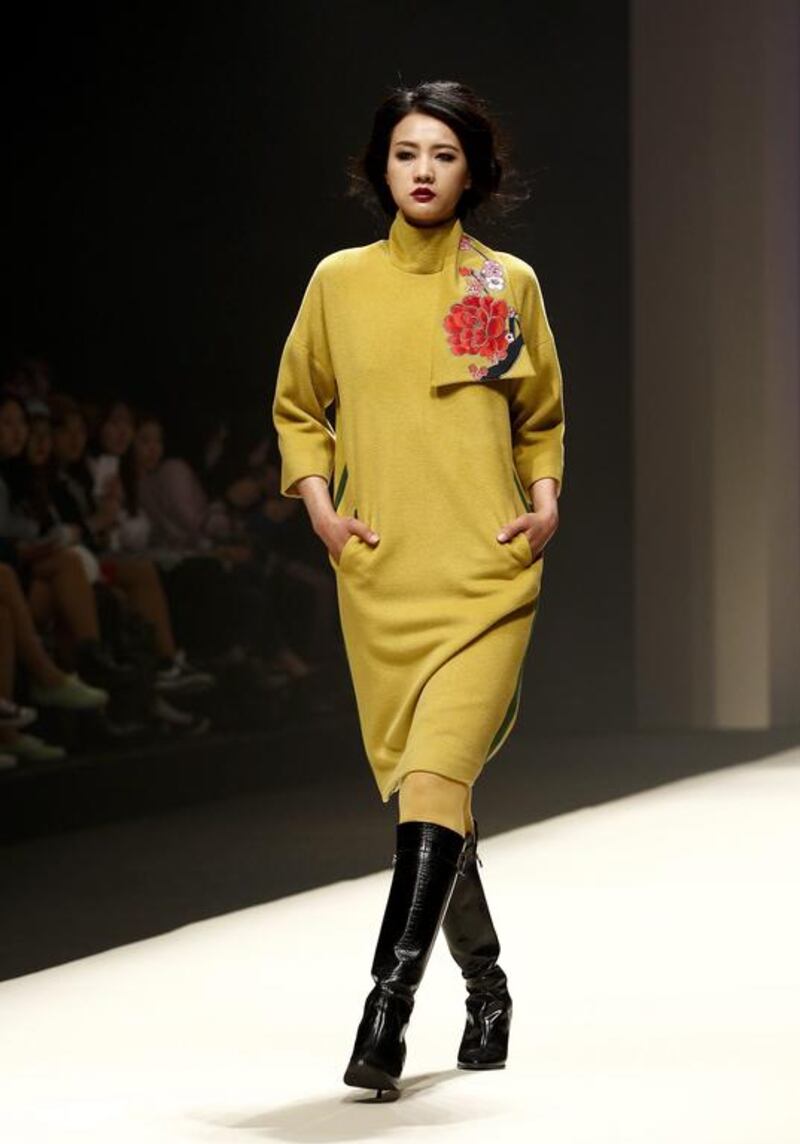  model presents a creation from the Fall / Winter 2014 collection by Jung Hun-Jong. Jeon Heon-Kyun / EPA