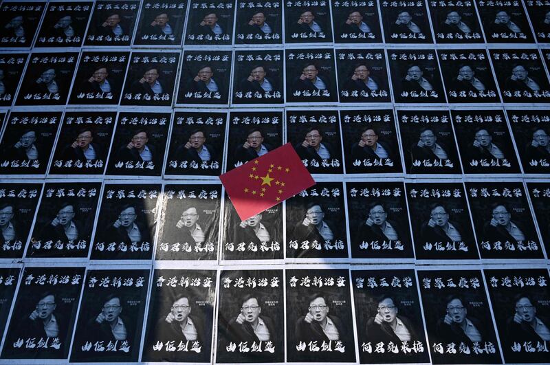 Posters of controversial pro-Beijing lawmaker Junius Ho are seen plastered onto paving stones in the grounds of the Chinese University of Hong Kong (CUHK), in Hong Kong.   AFP