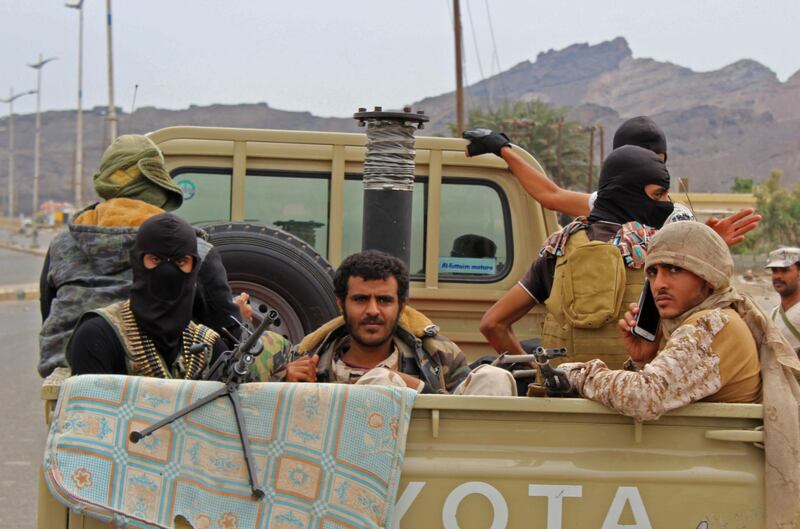 Fighters from Yemen's southern separatist movement sit in the back of a pick-up truck in the country's second city of Aden on January 28, 2018, during clashes with forces loyal to the Saudi-backed president. 
Yemen's government accused southern separatists of an attempted coup on after they took over its headquarters amid fierce clashes in Aden. President Abedrabbo Mansour Hadi called for his troops to cease fire after fighting between his military and forces backing the separatists killed 15 people. / AFP PHOTO / SALEH AL-OBEIDI