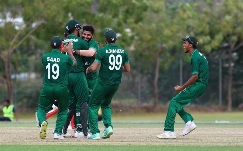 Saudi Arabia players celebrate a wicket against Hong Kong in Al Amerat