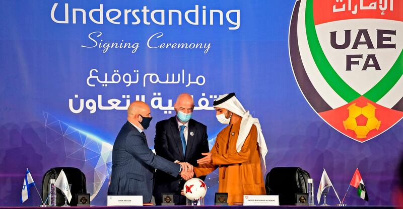 Israeli Football Association (IFA) president Oren Hasson and UAE Football Association (UAEFA) president Sheikh Rashid bin Humaid shake hands.  AFP