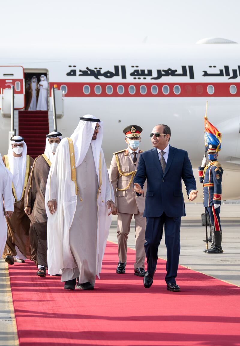 Sheikh Mohamed and Mr El Sisi leave the tarmac at Cairo International Airport. Hamad Al Kaabi / Ministry of Presidential Affairs 