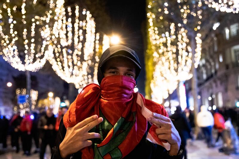 A fan is lit up with joy in Paris. AFP