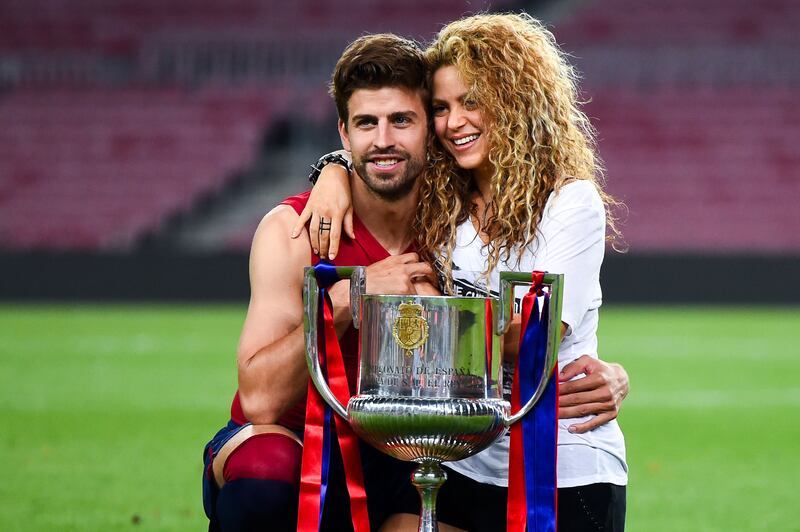 Gerard Pique and then partner Shakira pose with the trophy after Barcelona won the Copa del Rey final against Athletic at Camp Nou on May 30, 2015 in Barcelona, Spain. The pair announced a split in June 2022. Getty Images