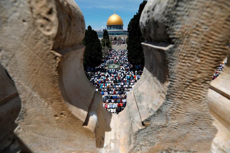 Palestinian Muslim worshippers pray in the al-Aqsa Mosque compound in Jerusalem on the first Friday prayers of the holy fasting month of Ramadan.  AFP