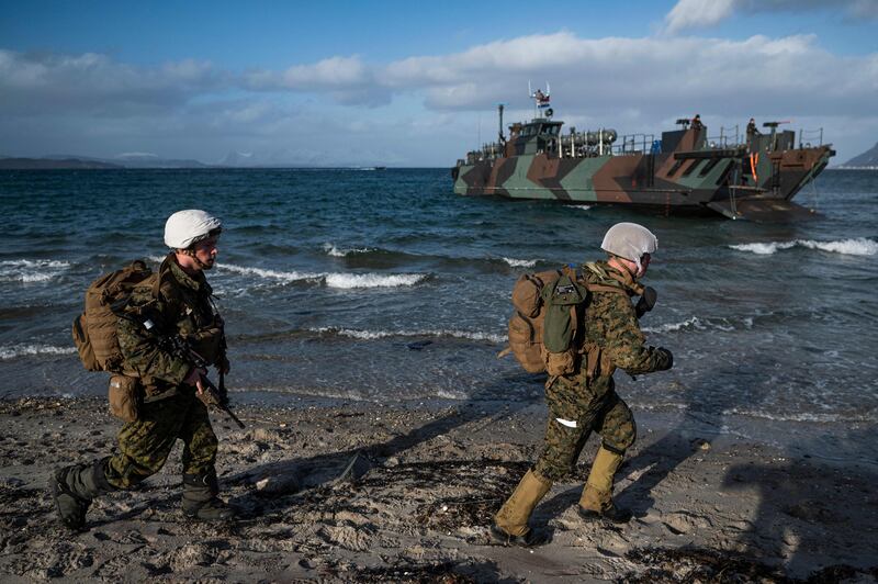 US soldiers from the 3rd Battalion, part of the 6th Marine Regiment participate in the international military exercise Cold Response 22, at Sandstrand, North of in Norway, on March 21, 2022. Cold Response is a Norwegian-led winter exercise in which NATO and partner countries participate. AFP