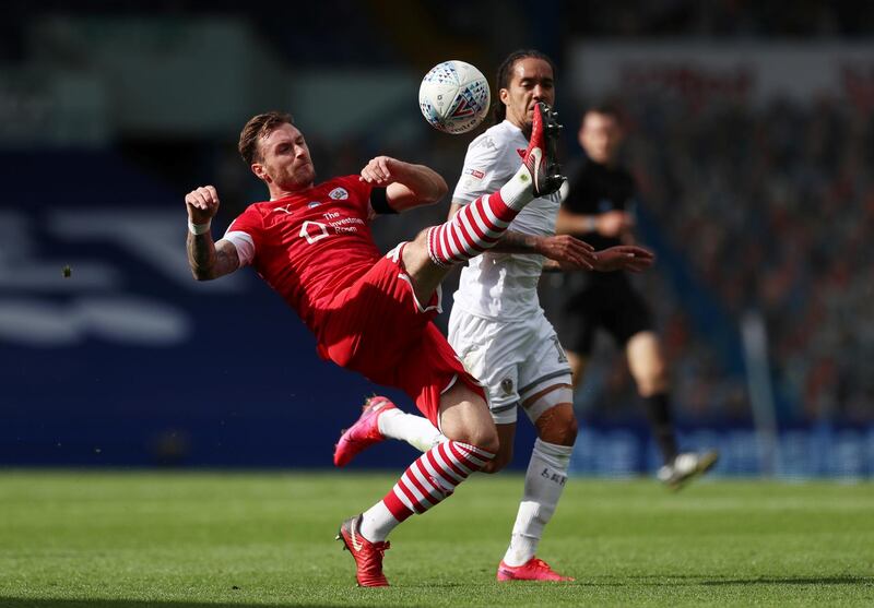 Leeds United's Helder Costa in action with Barnsley's Michael Sollbauer. Reuters