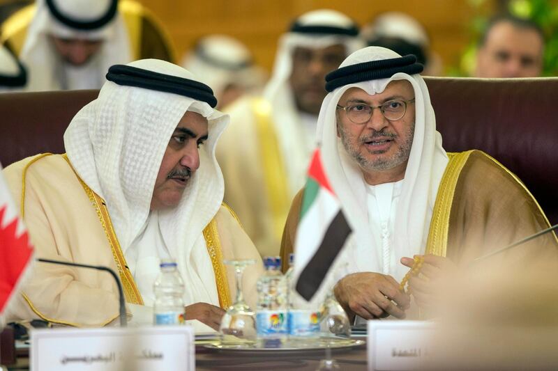 epa07915199 Bahrain's Foreign Minister Khalid bin Ahmed Al Khalifa (L) speaks with Anwar Mohammed Gargash (R), the United Arab Emirates (UAE) Minister of State for Foreign Affairs,as they attend an Arab League states' foreign ministers emergency meeting to discuss Syria situation, at the Arab League headquarters in Cairo, Egypt, 12 October 2019. Turkey has launched an offensive targeting Kurdish forces in north-eastern Syria, days after the US withdrew troops from the area.  EPA/Mohamed Hossam