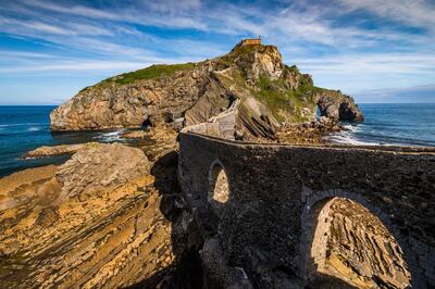 San Juan de Gaztelugatxe at sunset in Basque Country, Spain. On top of the island stands a little hermitage. Getty Images