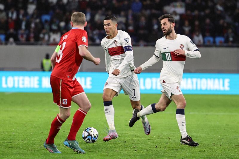 Portugal`s Cristiano Ronaldo, centre, and Bernardo Silva, right, in action against Luxembourg`s Laurent Jans. EPA