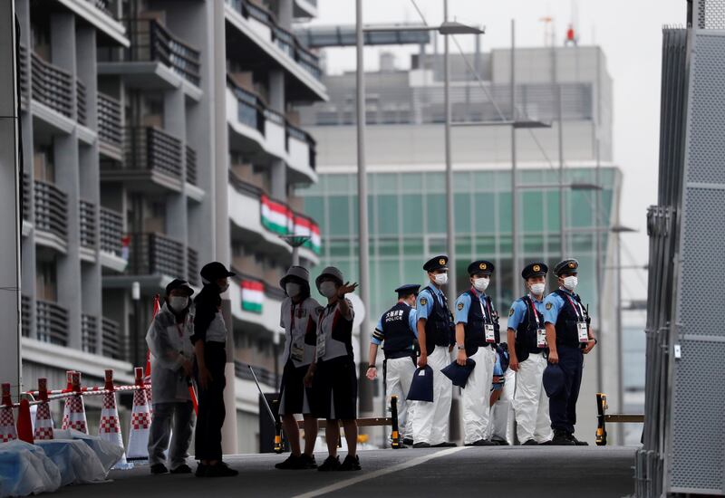 Police officers at a security checkpoint at the entrance to the Olympic Village that was opened on Tuesday, July 13, ahead of the Tokyo 2020 Games in Tokyo.