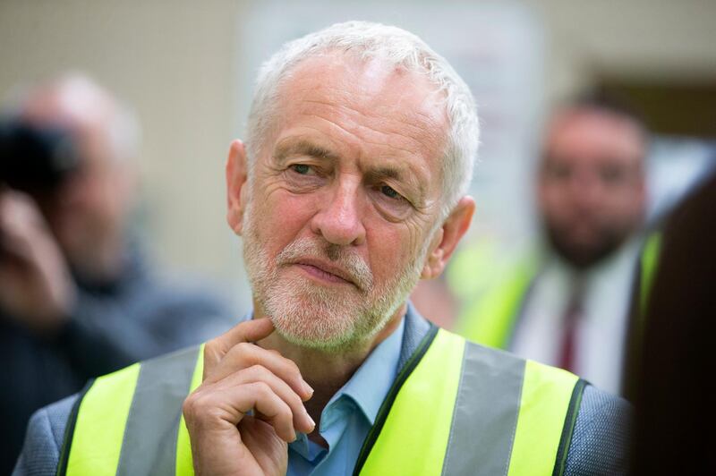 Britain's Labour leader Jeremy Corbyn during a visit to the Alexander Dennis bus manufacturer, in Falkirk, Scotland, to campaign on his party's 'Build It In Britain' policy, Monday Aug. 20, 2018. (Jane Barlow/PA via AP)