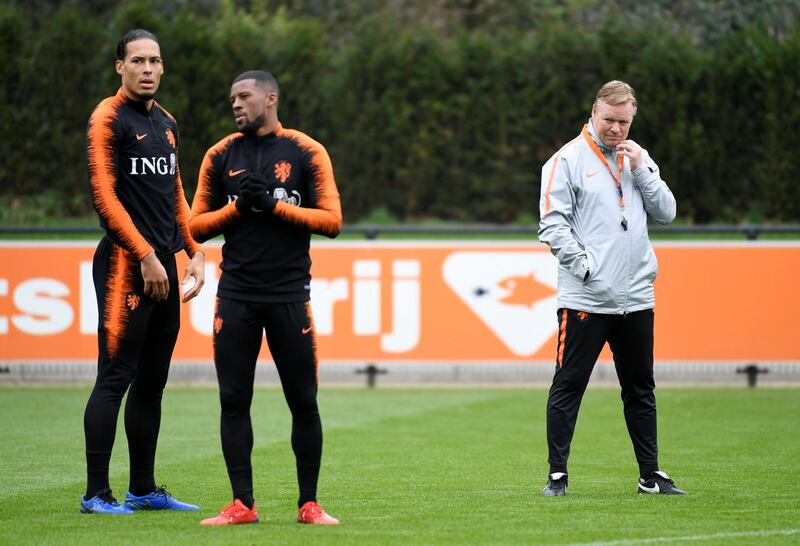 Soccer Football - Euro 2020 Qualifier - Netherlands Training - KNVB Campus, Zeist, Netherlands - March 23, 2019  Netherlands coach Ronald Koeman with Virgil van Dijk and Georginio Wijnaldum during training   REUTERS/Piroschka Van De Wouw