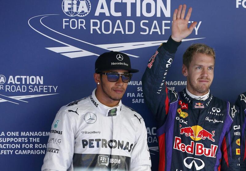 Lewis Hamilton, left, believes Sebastian Vettel’s dominance is a television turn-off. Kim Hong-Ji / Reuters