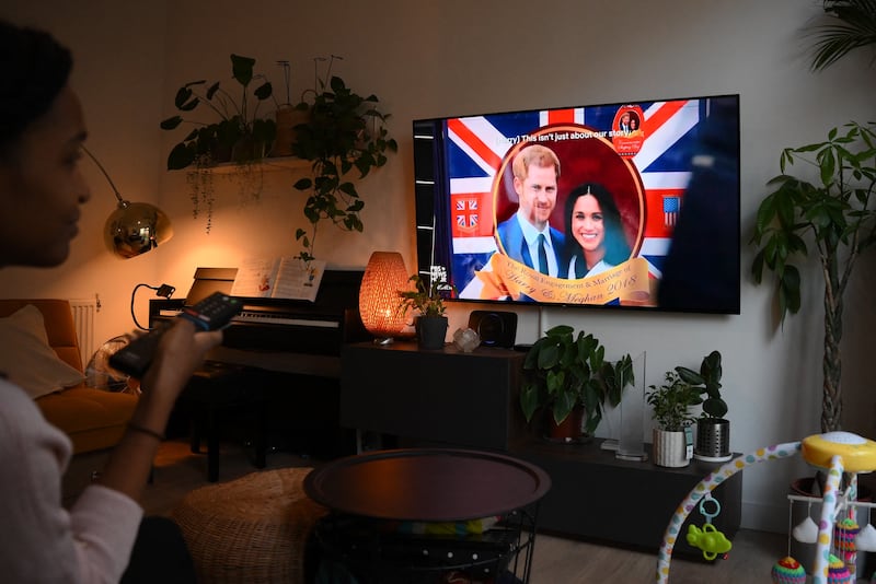 A woman in London watches the docuseries. AFP