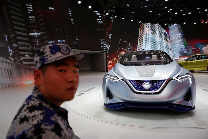 FILE PHOTO: A security guard stands next to a Nissan IDS concept car displayed during the Auto China 2016 auto show in Beijing, China, April 29, 2016.  REUTERS/Damir Sagolj/File Photo