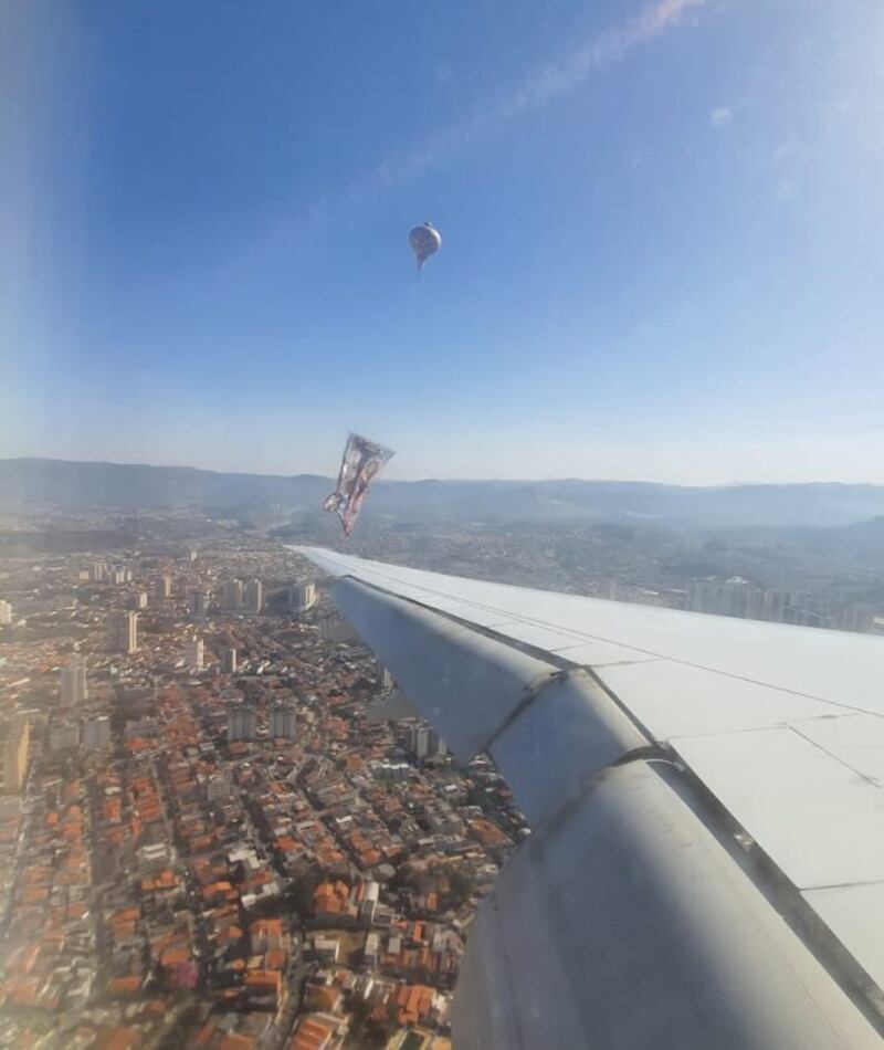 A passenger shared this image of how close the plane came to the balloon with local media