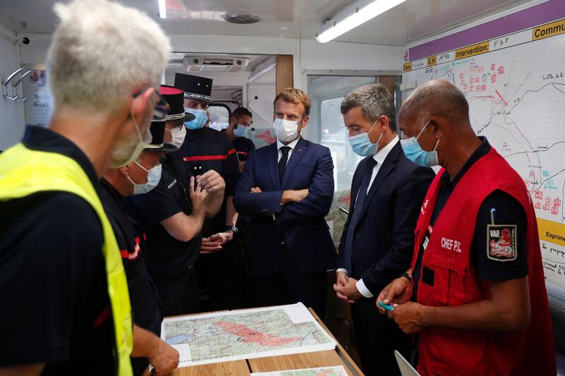 French President Emmanuel Macron visits the fire and rescue headquarters in Le Luc, near Saint-Tropez.