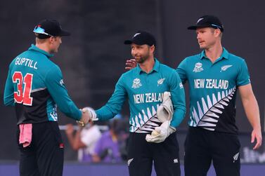 New Zealand's players celebrate their win in the ICC men’s Twenty20 World Cup cricket match between Namibia and New Zealand at the Sharjah Cricket Stadium in Sharjah on November 5, 2021.  (Photo by Giuseppe CACACE  /  AFP)