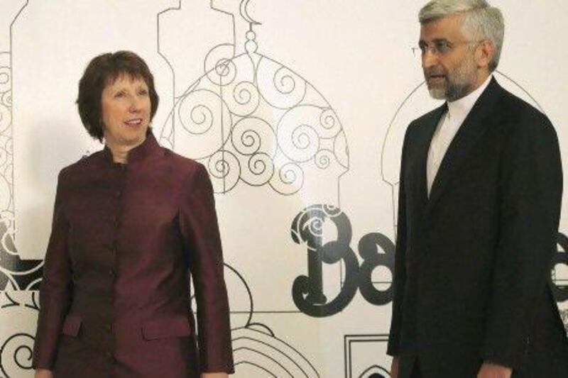 Catherine Ashton, the European Union foreign policy chief, left, walks with Iran's top nuclear negotiator Saeed Jalili before their meeting in Baghdad.