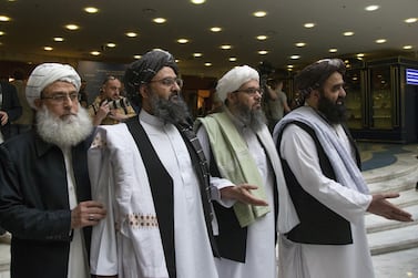 Mullah Abdul Ghani Baradar, the Taliban's top political leader, second left, arrives with other members of the militant group for talks in Moscow, Russia. AP 