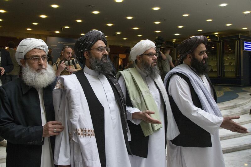 FILE - In this May 28, 2019 file photo, Mullah Abdul Ghani Baradar, the Taliban group's top political leader, second left, arrives with other members of the Taliban delegation for talks in Moscow, Russia. Afghanistanâ€™s Taliban leaders agreed they wanted a deal with the United States, but some among them were in more of a hurry than others. Even before U.S. President Donald Trump cancelled a mysterious Camp David summit on Saturday, Sept. 7, 2019, the Taliban negotiators were at odds with the council of leaders, or shura, that rules the Islamic movement. (AP Photo/Alexander Zemlianichenko, File)