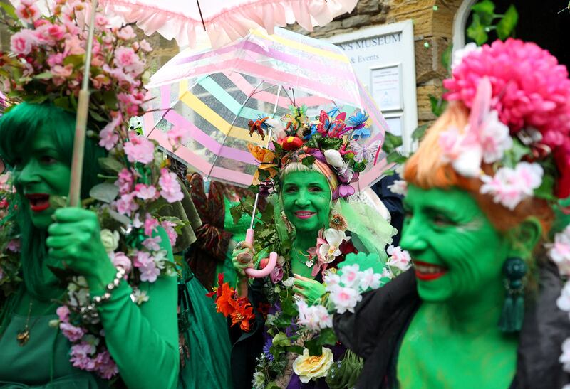 People attend the annual Jack In The Green parade and festival in Hastings, Britain. Reuters