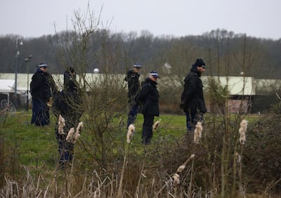 Officers from the Metropolitan Police search land near to Great Chart Golf and Lesiure, in connection with the disappearance of Sarah Everard, in Ashford, England, Wednesday March 10, 2021. Britain's Metropolitan police says an officer has been arrested in connection with the case of a woman who went missing in London last week. The force said the fact that the man is a serving police officer is â€œshocking and deeply disturbing.â€ Police said the officer was arrested late Tuesday in Kent, southeast of London, as part of the investigation into the disappearance of Sarah Everard. (Gareth Fuller /PA via AP)
