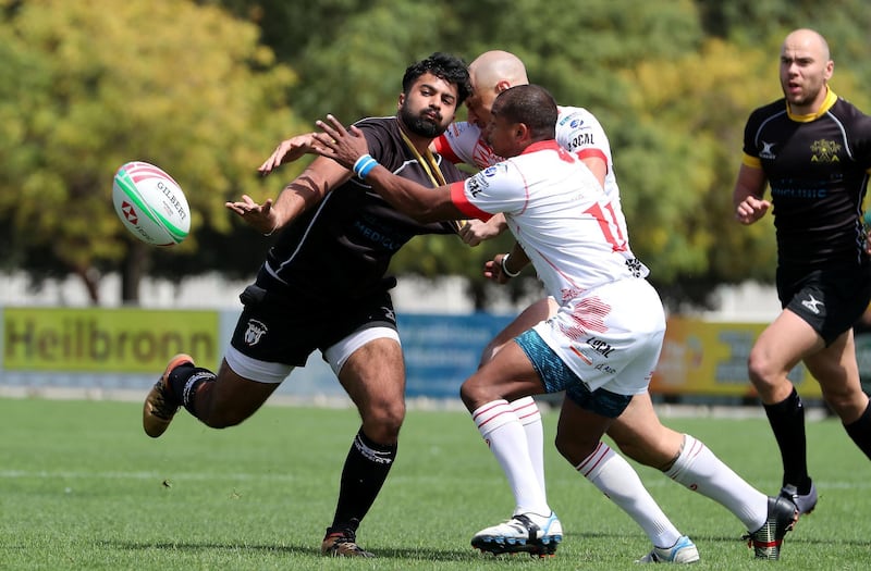DUBAI , UNITED ARAB EMIRATES , March 29 – 2019 :- Ebrahim Doraee ( no 15 black ) from Al Ain Amblers in action during the UAE Conference final rugby match against Dubai Tigers at the Sevens Rugby Ground on Dubai- Al Ain road in Dubai.( Pawan Singh / The National ) For Sports/Online. Story by Paul