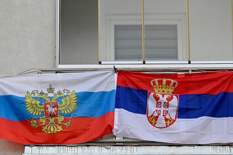 Russian and Serbian national flags on a balcony in the divided town of Mitrovica. AFP