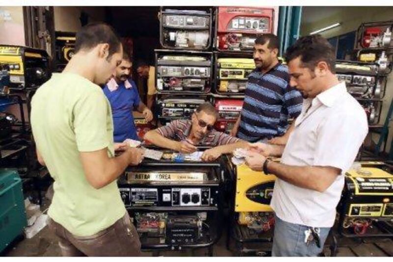 Residents purchase generators at a Baghdad store. With electricity supply vastly overstretched, Iraqis have had to endure power outages for years.