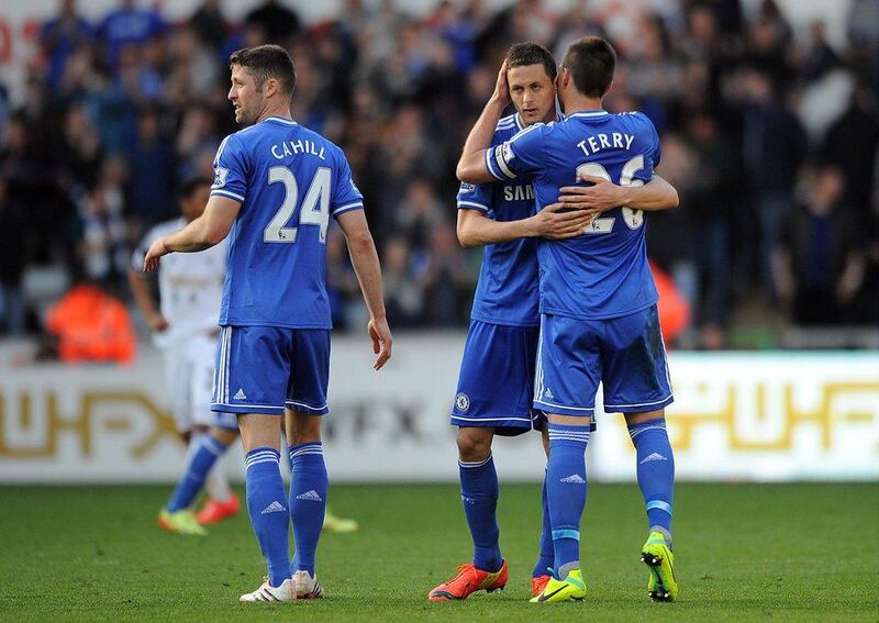 John Terry of Chelsea embraces teammate Nemanja Matic at full-time following their Premier League match between against Swansea City at the Liberty Stadium on April 13, 2014 in Swansea, Wales. Chris Brunskill/Getty Images