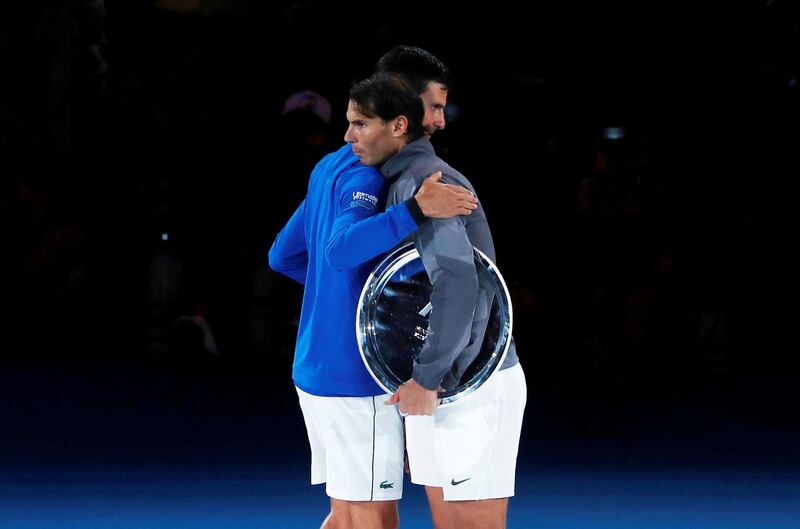 Novak Djokovic and Rafael Nadal embrace after the match. Reuters