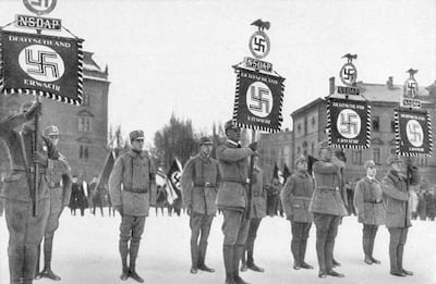 1923:  Nazi supporters parading in Munich.  (Photo by Hulton Archive/Getty Images)