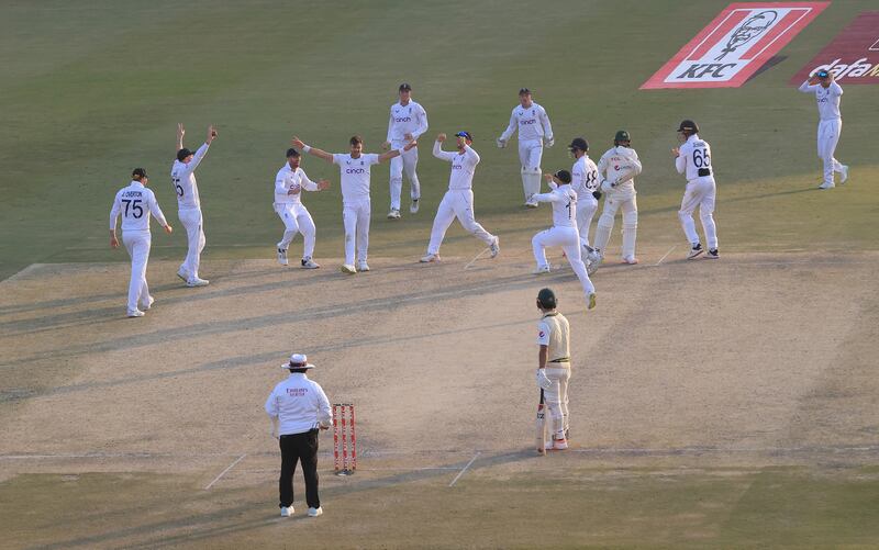England bowler James Anderson celebrates with teammates after taking the wicket of Haris Rauf. Getty