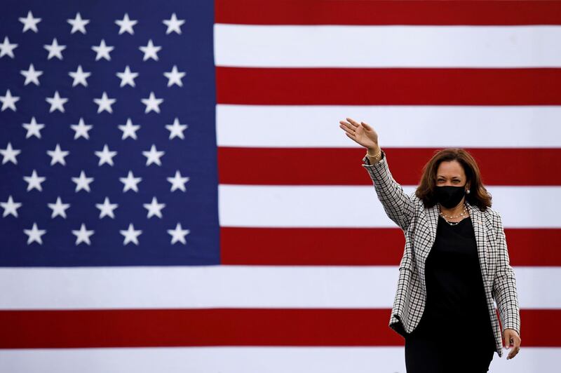 US Democratic vice presidential nominee Senator Kamala Harris waves supporters as she arrives for a campaign drive-in rally at Palm Beach State College in West Palm Beach, Florida.  Reuters