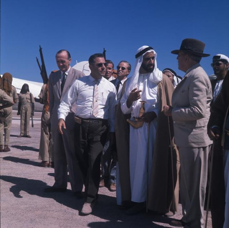 Archival photograph of the Trucial States shot by photographer Guy Gravett in 1962. Sheikh Zayed talks to oil industry executives on Das Island in 1962. 

Eds note** Karen *** Permission needed before use. Contact Crispin Gravett Cpgravett@aol.com. $150 one print use and 5 years online. 