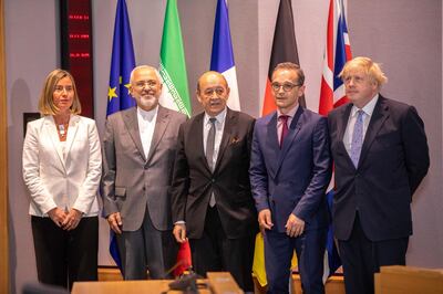 Iran's Foreign Minister Mohammad Javad Zarif (2L) poses for a photograph with Britain's Foreign Secretary Boris Johnson (R), France's Foreign Minister Jean-Yves Le Drian (C), Germany Foreign Minister Heiko Maas (2R) -- the ministers of the three European signatories to the 2015 nuclear deal - and EU High Representative for Foreign Affairs Federica Mogherini (L) during a meeting in Brussels, on May 15, 2018.  
Iran's foreign minister said on May 15 that efforts to save the nuclear deal after the abrupt US withdrawal were "on the right track" as he began talks with European powers in Brussels. / AFP PHOTO / POOL / Olivier Matthys