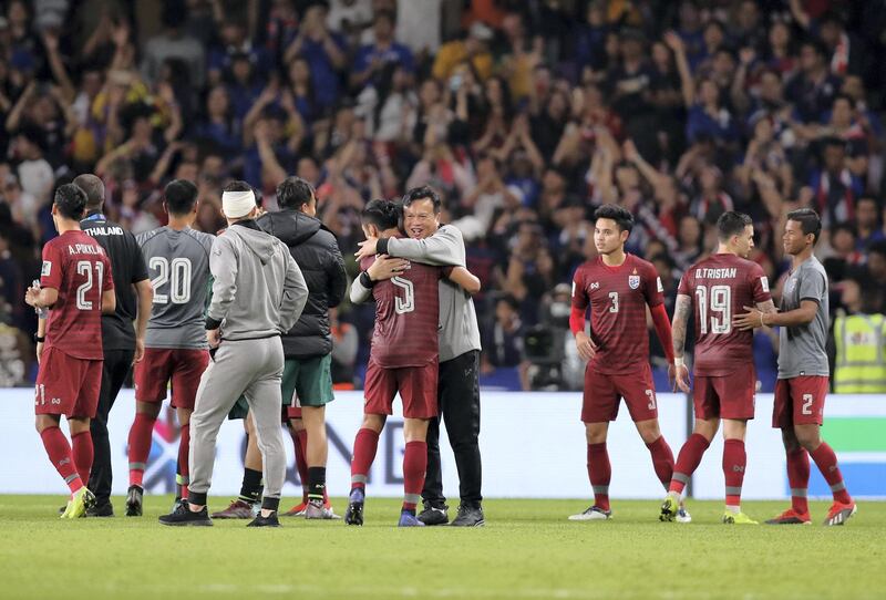 Al Ain, United Arab Emirates - January 14, 2019: Thailand interim manager Sirisak Yodyadthai celebrates the draw after the game between UAE and Thailand in the Asian Cup 2019. Monday, January 14th, 2019 at Hazza Bin Zayed Stadium, Al Ain. Chris Whiteoak/The National