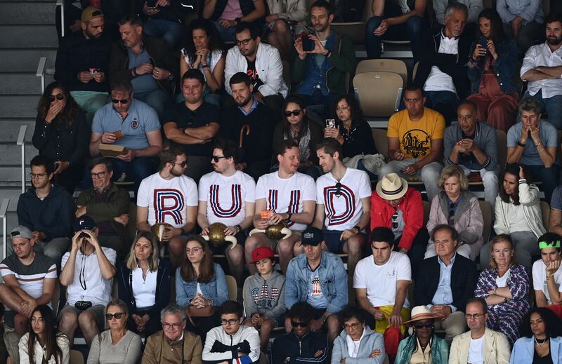 Spectators show their support for Norway's Casper Ruud. AFP