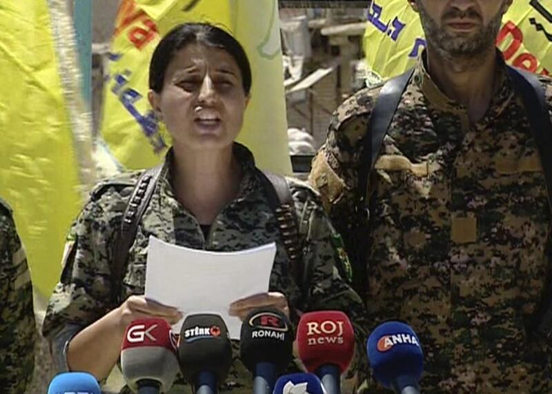 Syrian Democratic Forces spokeswoman Jihan Sheikh Ahmed reads out a statement by the US-backed alliance in the northern town of Tabqa on May 12, 2017. Syrian Democratic Forces via AP