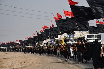 Shiite Muslim pilgrims march to Karbala, from Iraq's southern province of Al Muthanna, on September 6, 2022. AFP