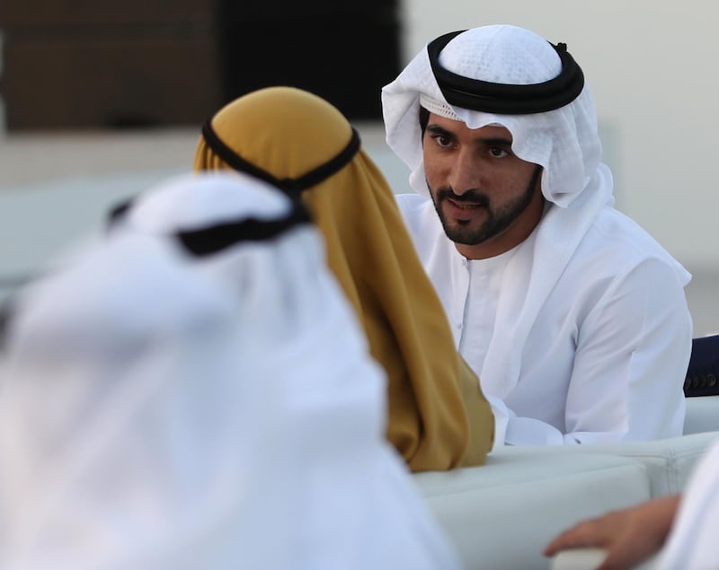 Dubai's Crown Prince Sheikh Hamdan bin Mohammed bin Rashid Al-Maktoum (R), is pictured during a ceremony presenting the new logo of Dubai Airoprt, in Dubai, on February 13, 2019. / AFP / KARIM SAHIB
